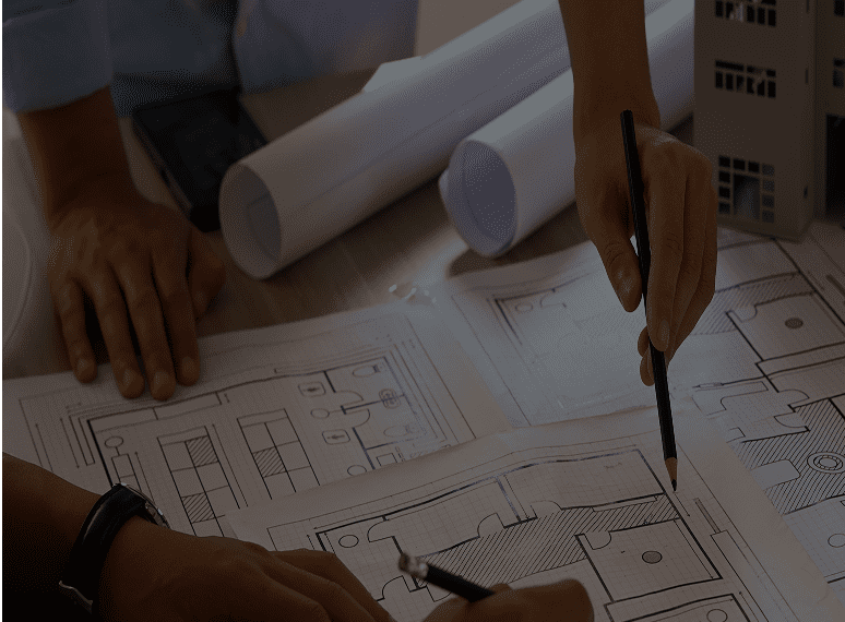 Architects discussing building plans and blueprints.
